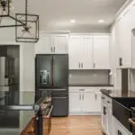 Kitchen with custom cabinetry and deep base sink designed for busy family cooking.