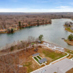 Aerial view of the bocce ball court and shoreline site work along the lake in Fairfield Glade
