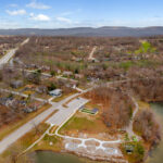 Aerial view of the bocce ball court with wooded ridgelines in the background near Fairfield Glade