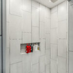 Tiled walk-in shower with a rain shower head and a built-in shampoo niche