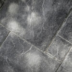 Close-up of the stamped, colored concrete flooring in the outdoor living space