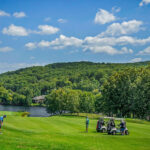 View of the adjoining golf course and lake from the Powers' outdoor living space