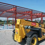 CAT telehandler on site during steel erection of pre-engineered metal building in Crossville, TN